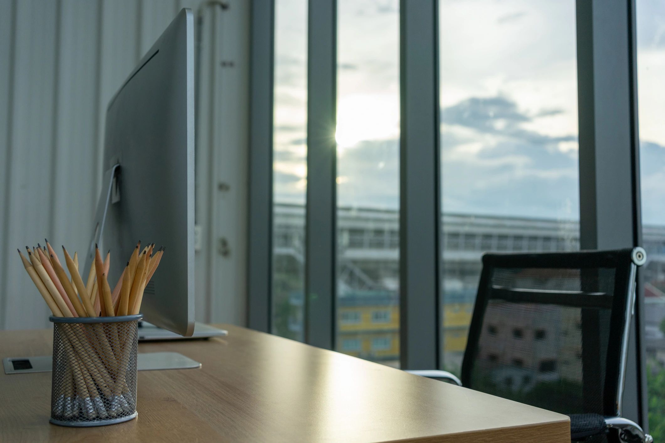 Modern office desk with laptop and monitor